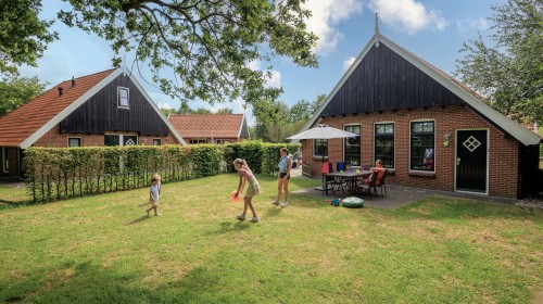 Terras kinderbungalow Boerderij Kaps